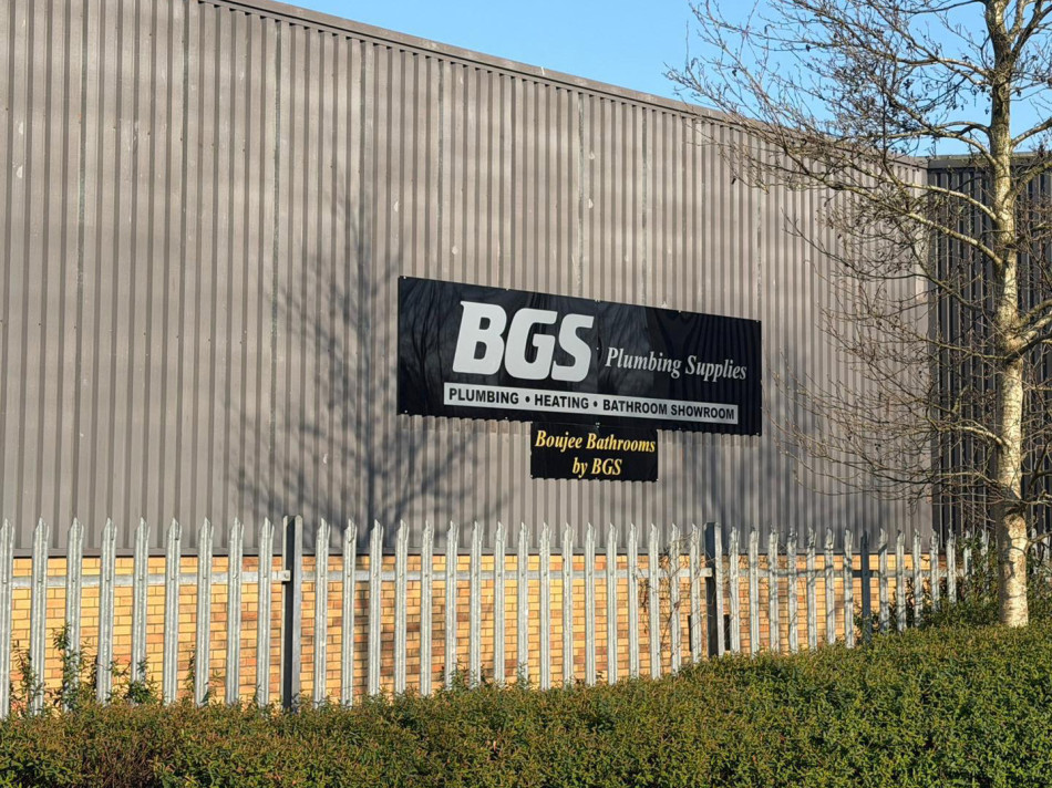 Exterior shot of the BGS Plumbing Supplies building showcasing the Boujee Bathrooms banner.